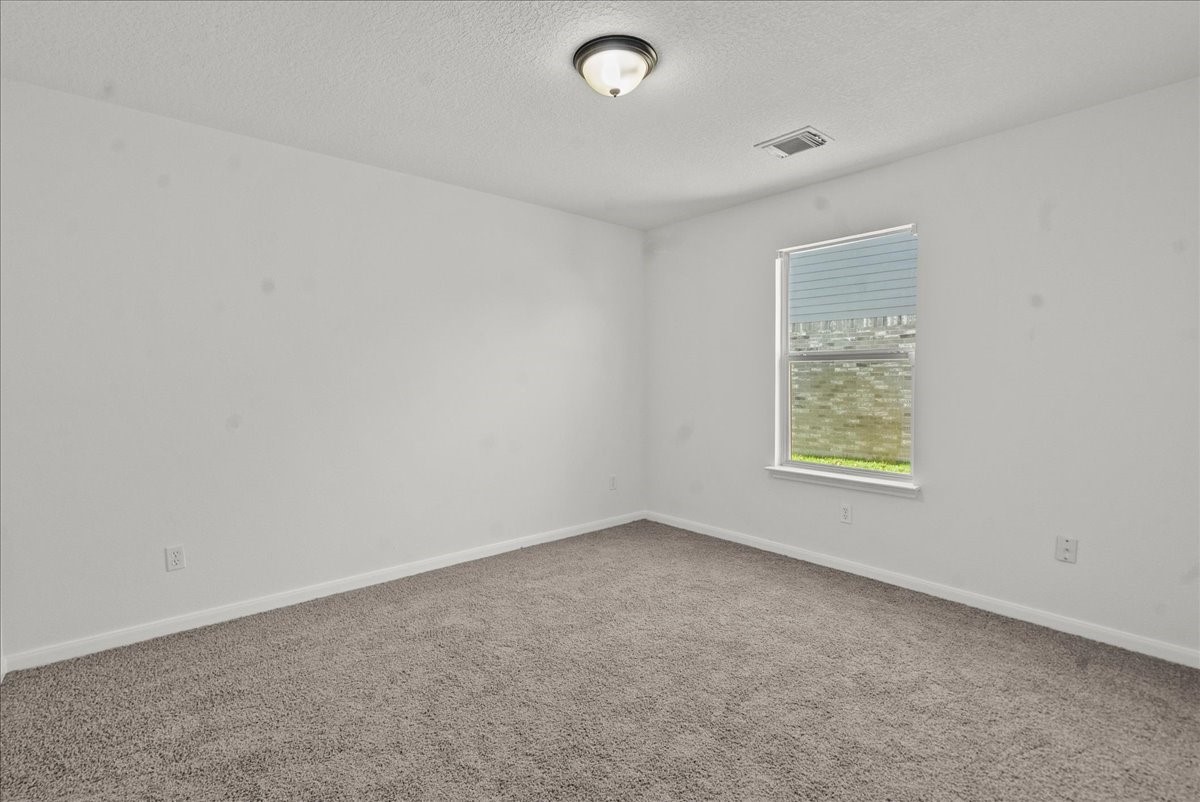 726 Flying Bridge Way Crosby, TX 77532 - Photo 21 of 32 an empty room with a window
