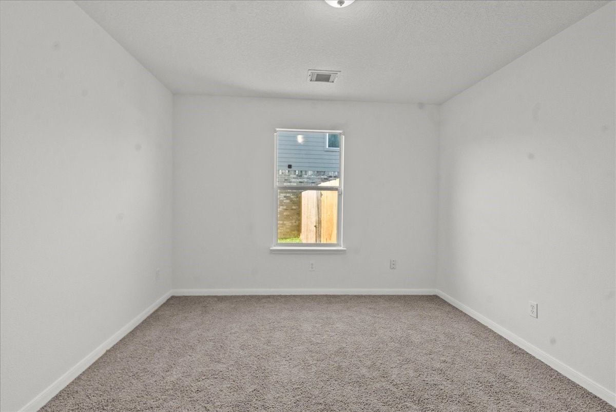 726 Flying Bridge Way Crosby, TX 77532 - Photo 22 of 32 an empty room with a window