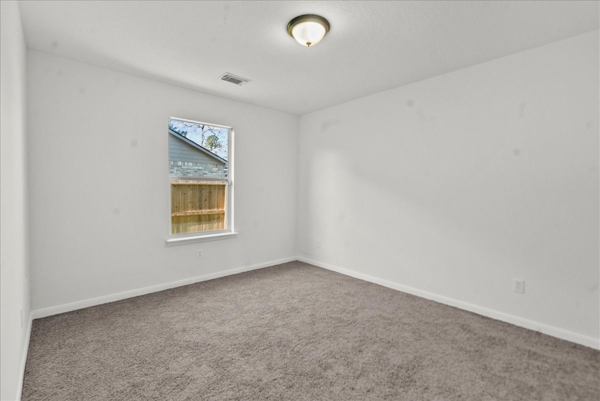726 Flying Bridge Way Crosby, TX 77532 - Photo 24 of 32 an empty room with a window