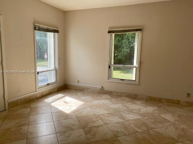 4450 Jog Road Lake Worth, FL 33467 - Photo 13 of 18 a view of an empty room with a window
