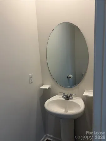 a bathroom with a sink and mirror