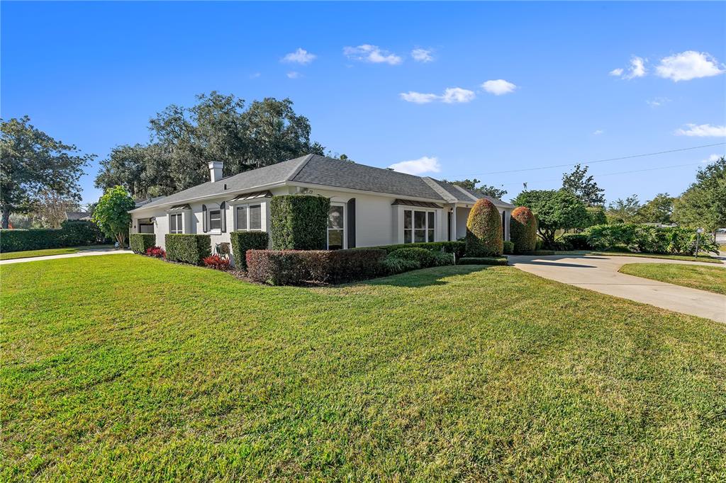 850 Juanita Rael Road Winter Park, FL 32789 - Photo 2 of 50 a front view of a house with garden
