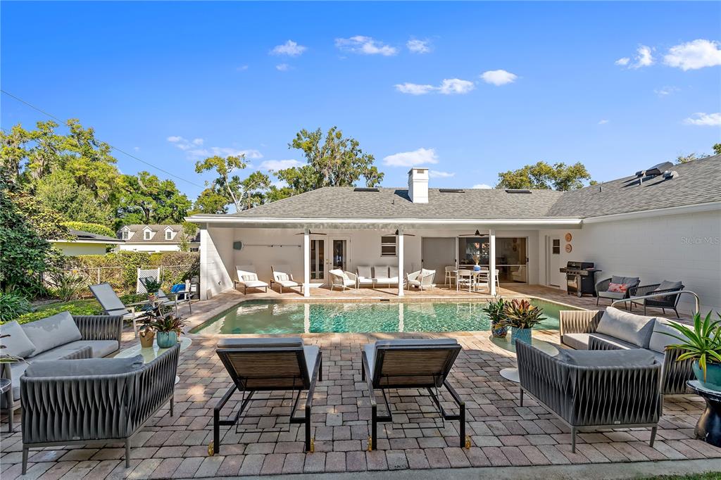 850 Juanita Rael Road Winter Park, FL 32789 - Photo 32 of 50 a view of house with a chairs and table in the patio