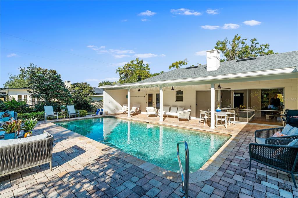 850 Juanita Rael Road Winter Park, FL 32789 - Photo 35 of 50 a view of a house and swimming pool with a backyard
