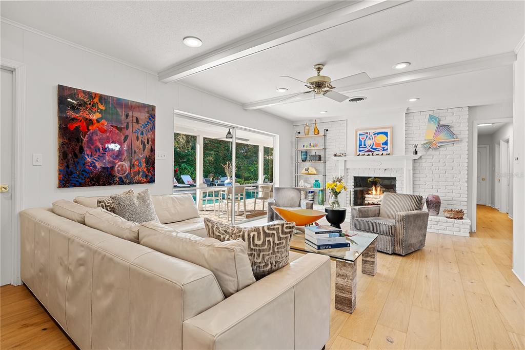 850 Juanita Rael Road Winter Park, FL 32789 - Photo 9 of 50 a living room with furniture fireplace and a large window