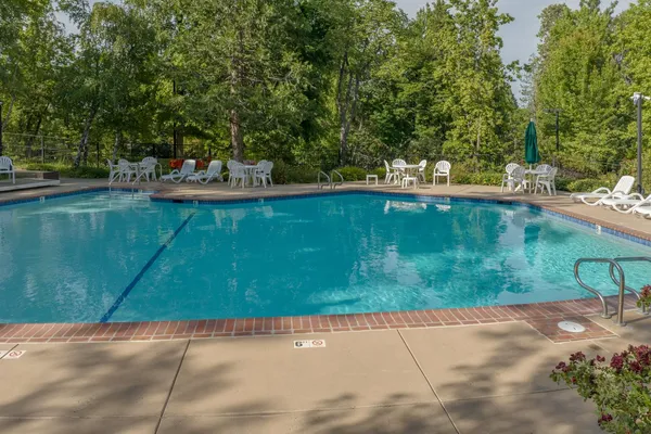 a view of a swimming pool with a patio