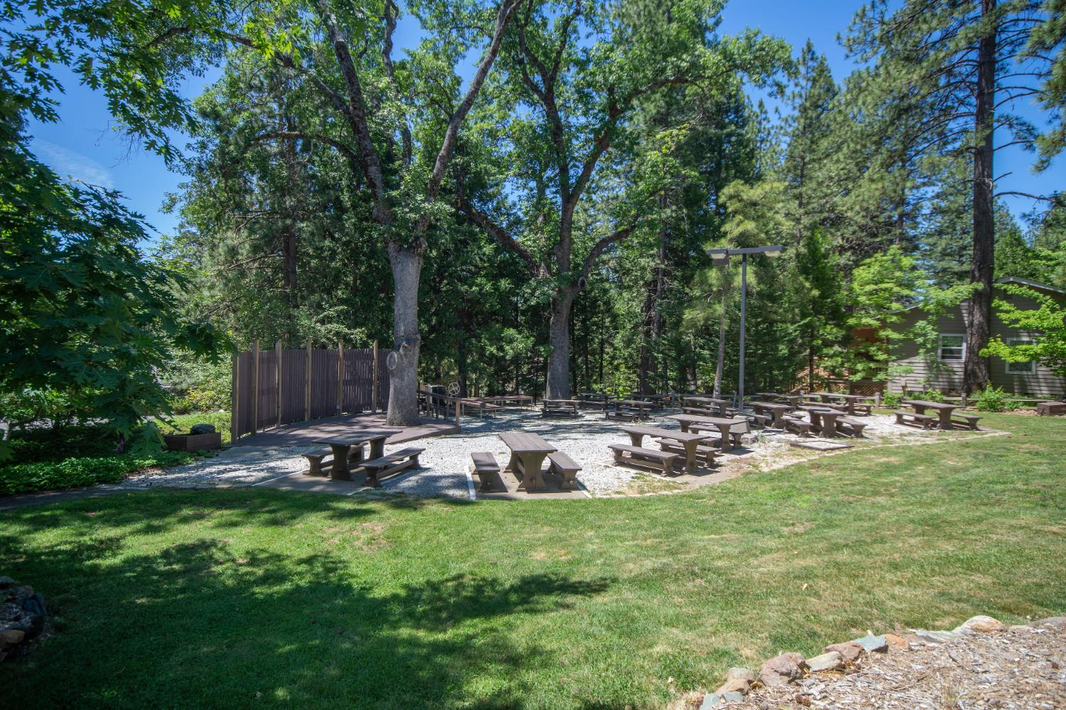 1202 Heather Drive Murphys, CA 95247 - Photo 14 of 15 a backyard of a house with table and chairs