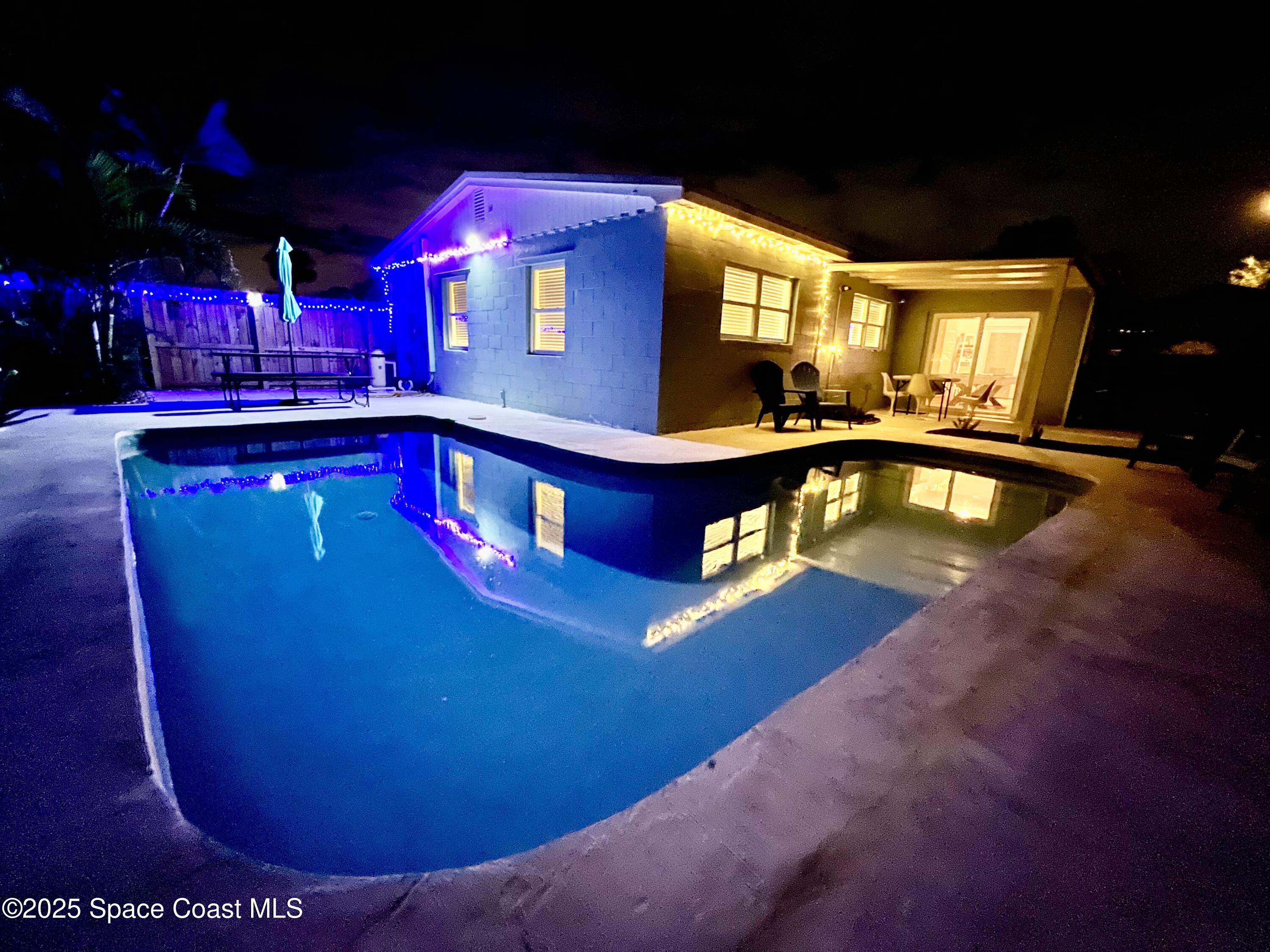 133 Northeast 1st Street Satellite Beach, FL 32937 - Photo 20 of 27 a view of a swimming pool with an outdoor space