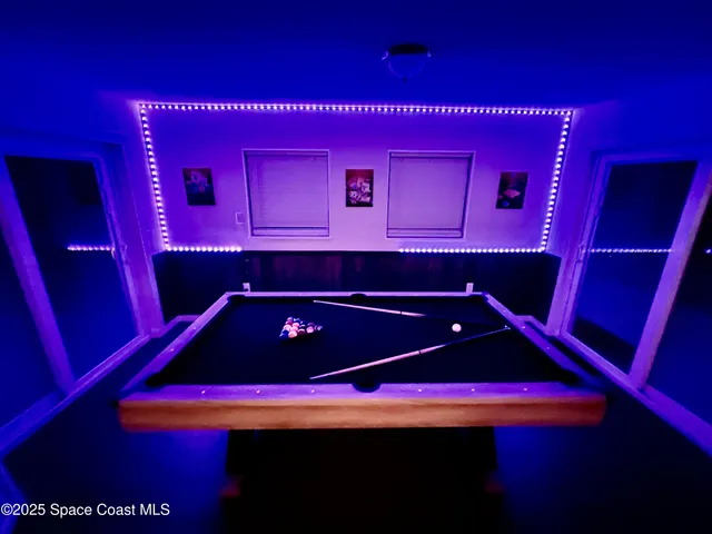 a room that has a dresser with wooden floor