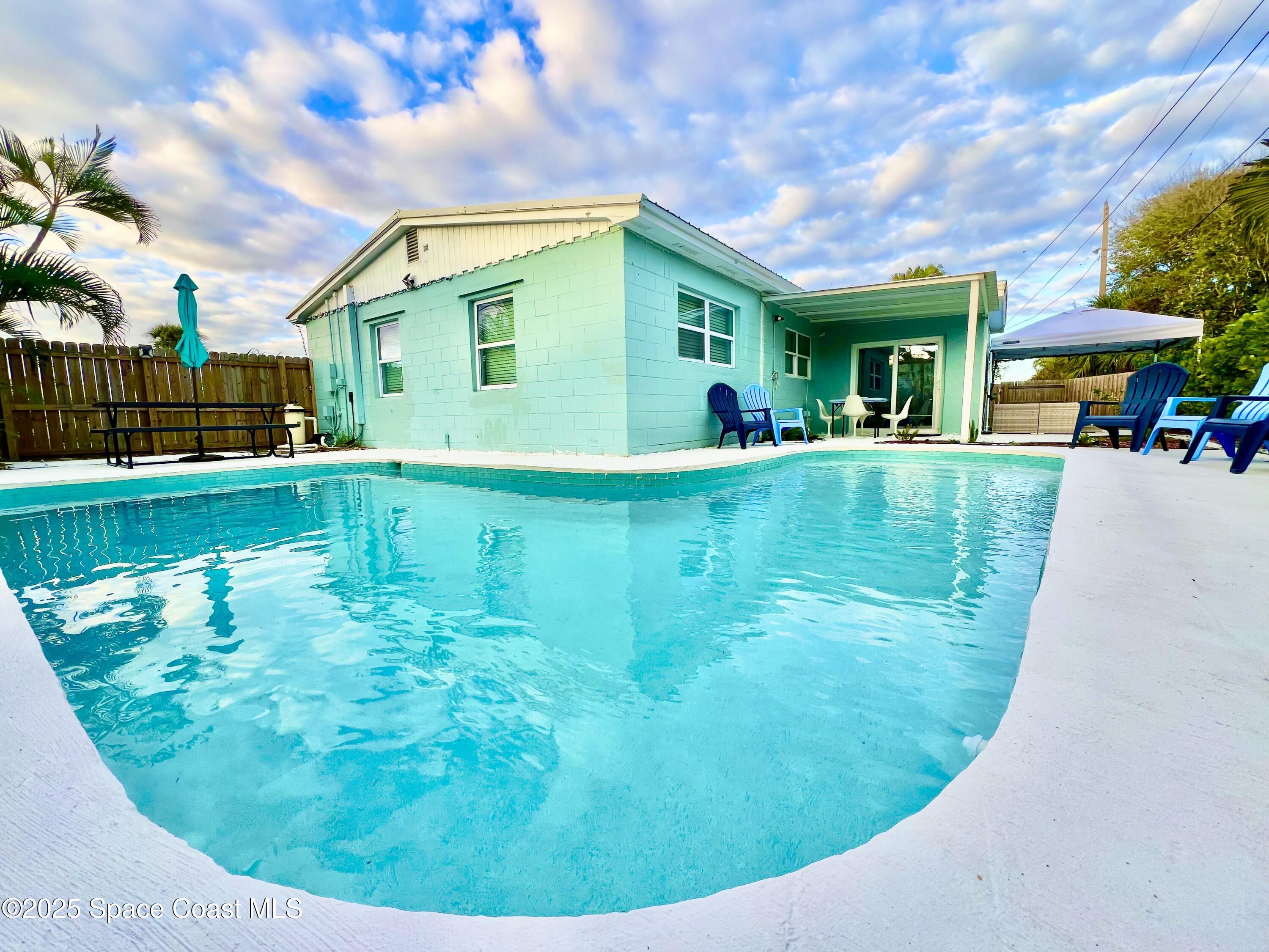 133 Northeast 1st Street Satellite Beach, FL 32937 - Photo 24 of 27 a view of a house with a backyard