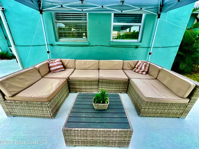 a view of a two chairs in the patio