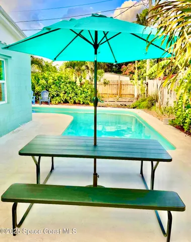 a view of swimming pool from a bench