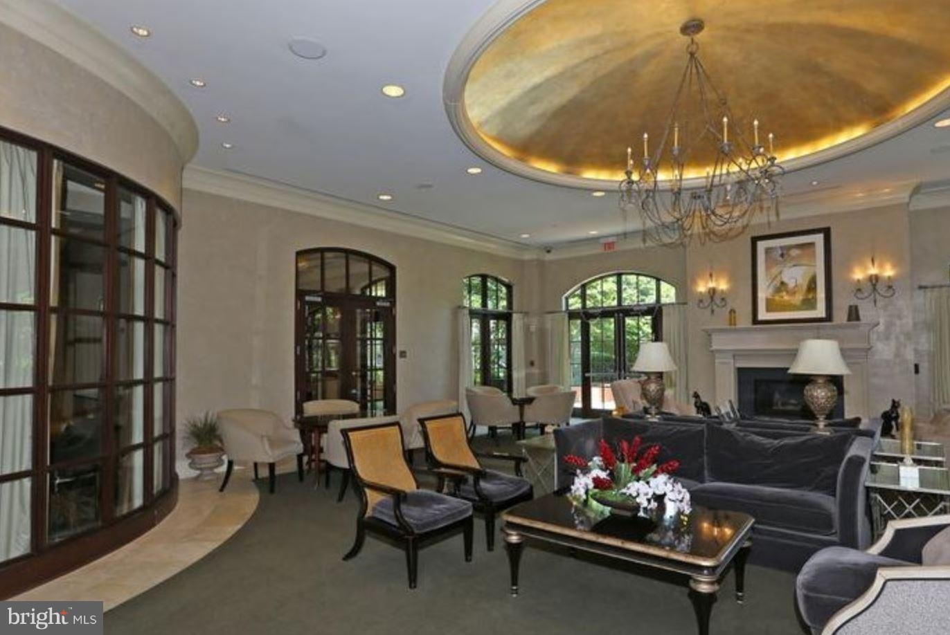 11710 Old Georgetown Road, Unit 422 North Bethesda, MD 20852 - Photo 19 of 29 a living room with furniture and a chandelier