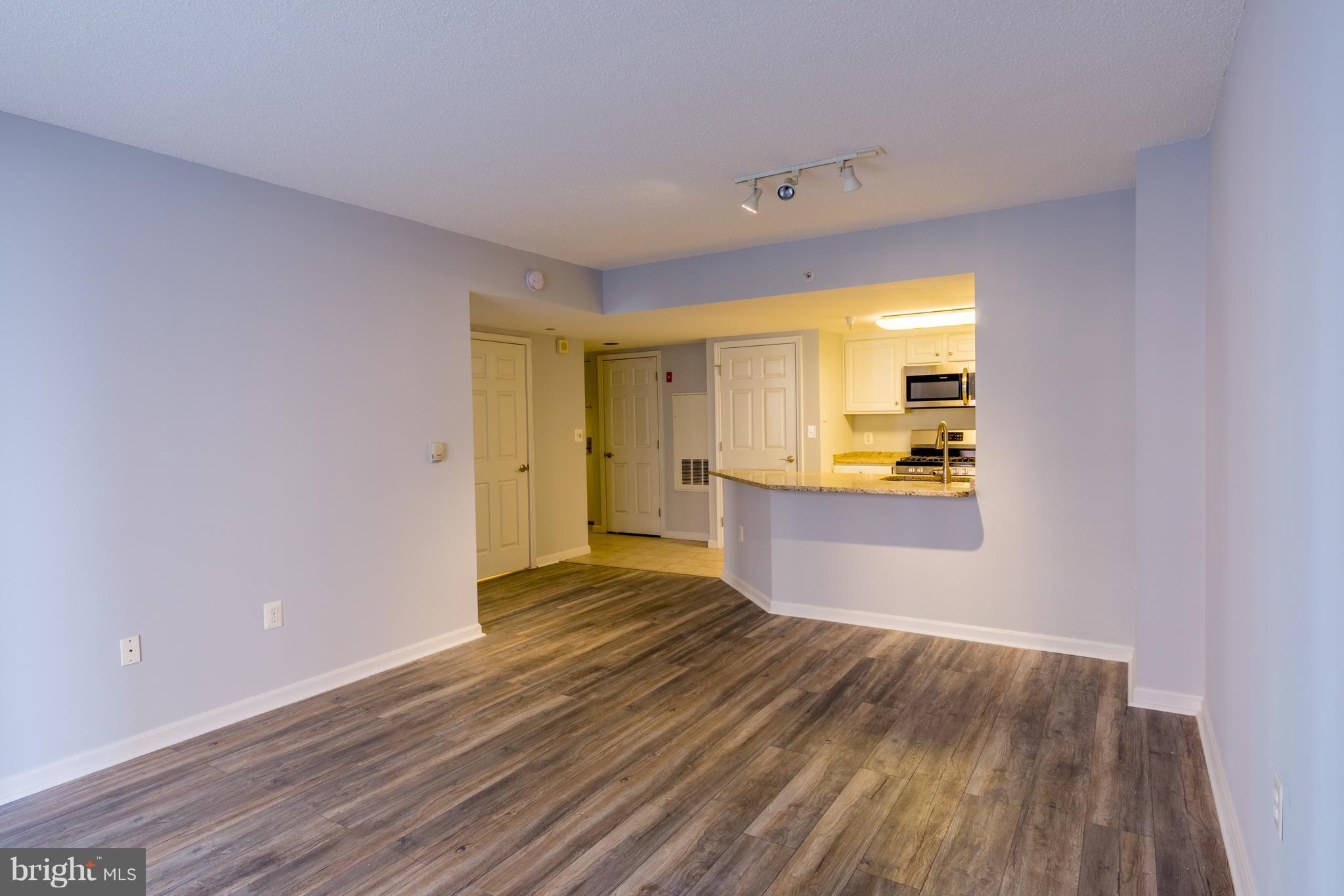 11710 Old Georgetown Road, Unit 422 North Bethesda, MD 20852 - Photo 7 of 29 a view of kitchen and wooden floor