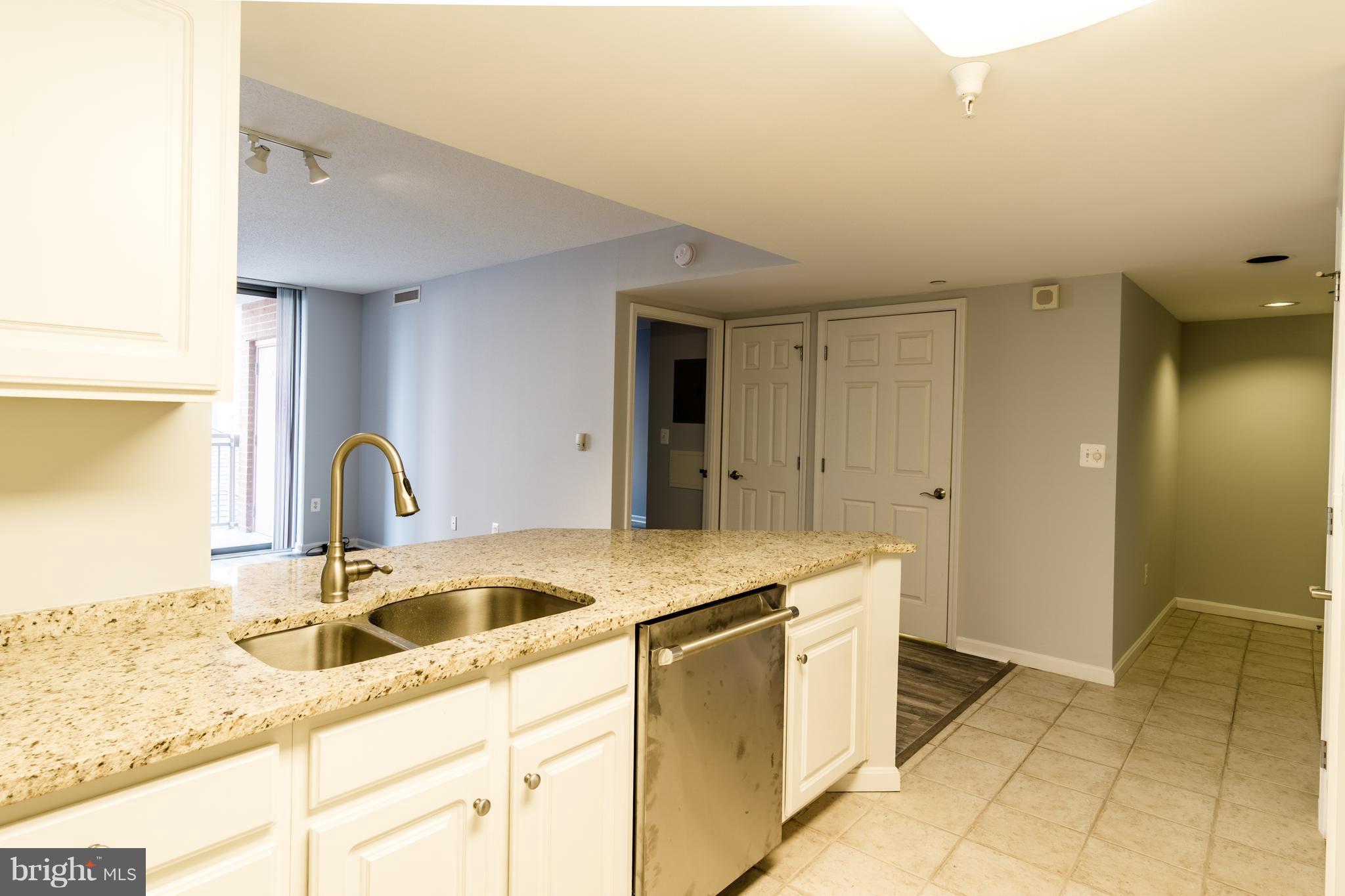 11710 Old Georgetown Road, Unit 422 North Bethesda, MD 20852 - Photo 8 of 29 a kitchen with a sink cabinets and utility
