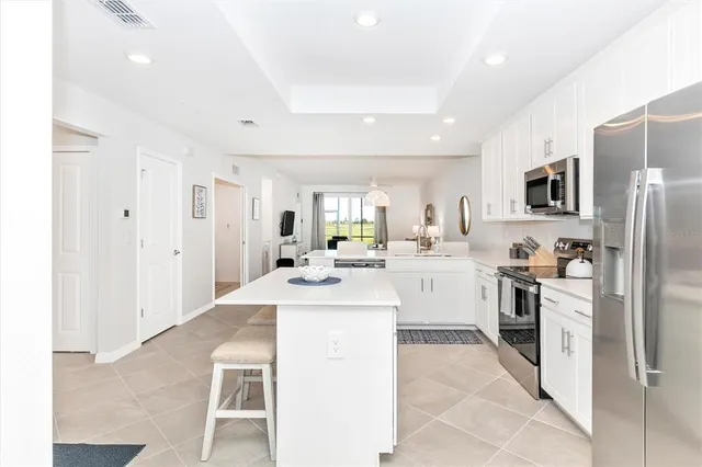 a living room with couch and a floor to ceiling window