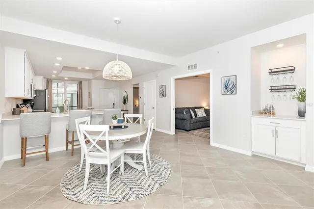 a spacious bedroom with a bed and a window