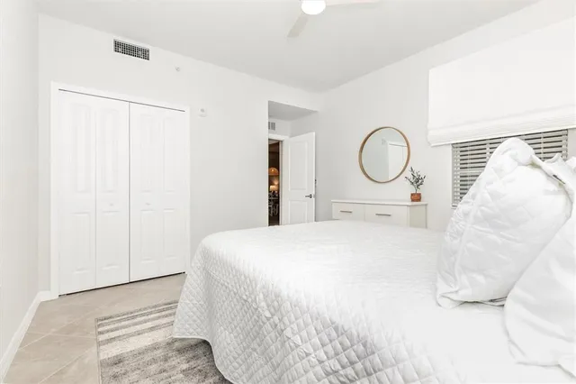 a living room with lots of furniture and a chandelier