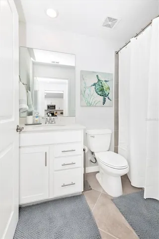 a building with car parked in front of it