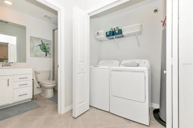 a view of a patio with a table and chairs