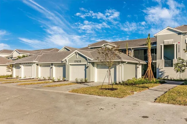a view of a swimming pool with an ocean and trees