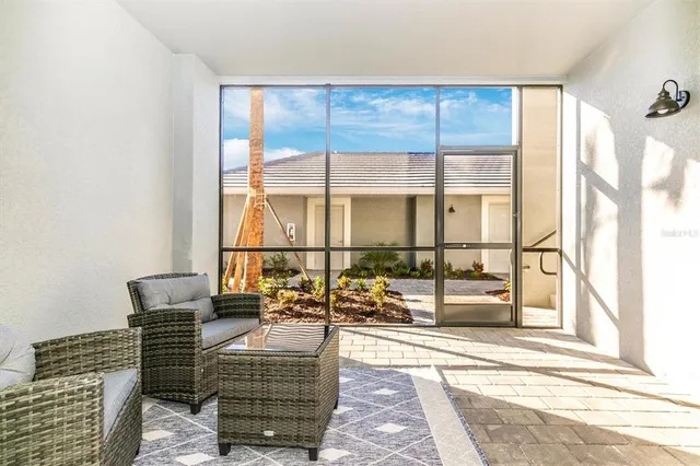 a kitchen with stainless steel appliances granite countertop a sink a stove a microwave and cabinets