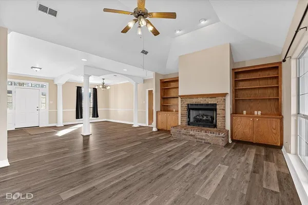 a kitchen with a sink refrigerator and cabinets