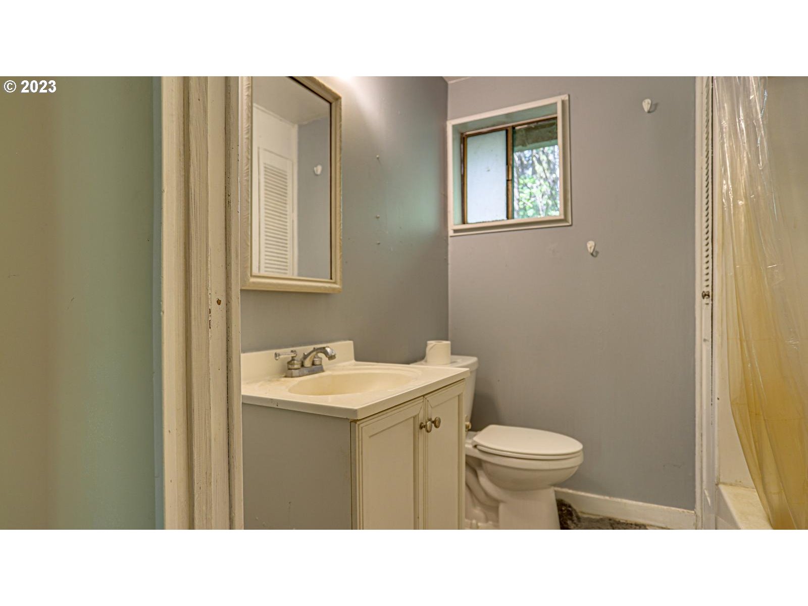 19830 South Hinkle Road Oregon City, OR 97045 - Photo 17 of 47 a bathroom with a sink toilet and mirror