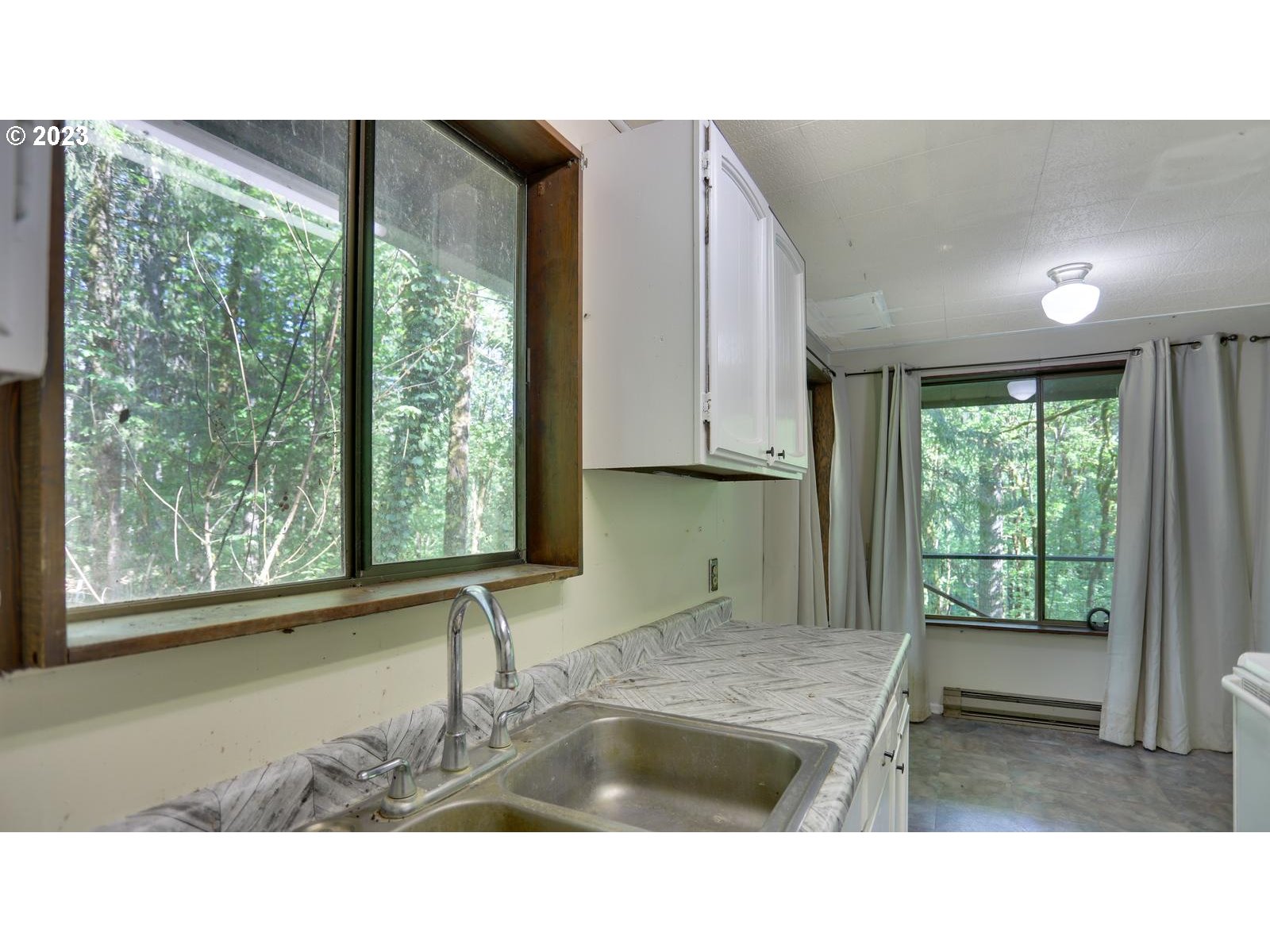 19830 South Hinkle Road Oregon City, OR 97045 - Photo 21 of 47 a kitchen with a sink and large window