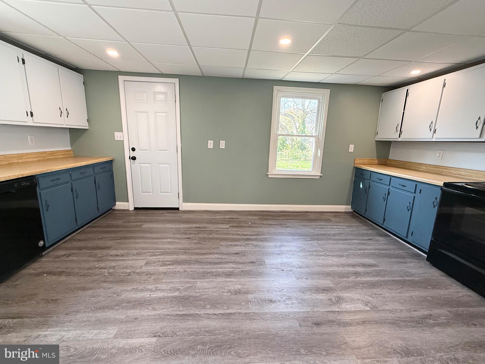 305 Central Avenue Ridgely, MD 21660 - Photo 14 of 19 a view of a kitchen with wooden floor and electronic appliances