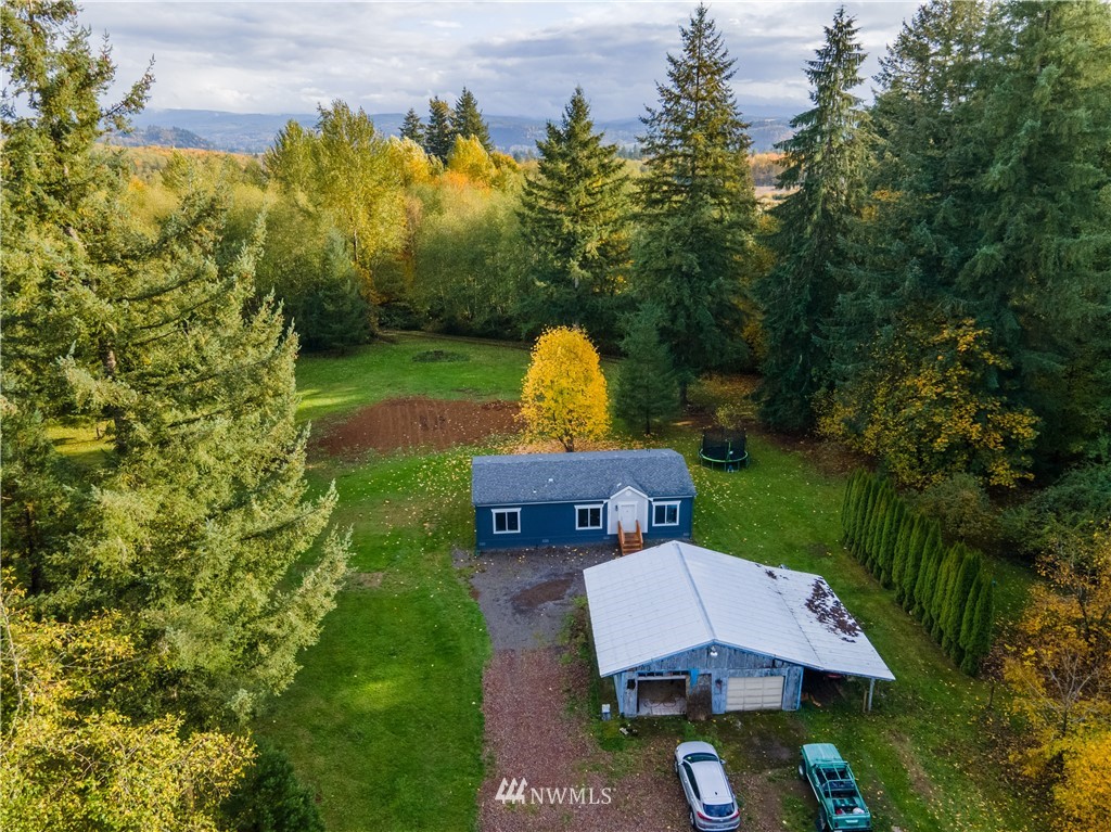 729 Cinebar Road, Unit A Cinebar, WA 98533 - Photo 1 of 30 a view of a house with a garden and a sitting area
