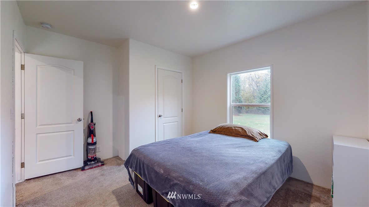729 Cinebar Road, Unit A Cinebar, WA 98533 - Photo 16 of 30 a bedroom with a bed and a window