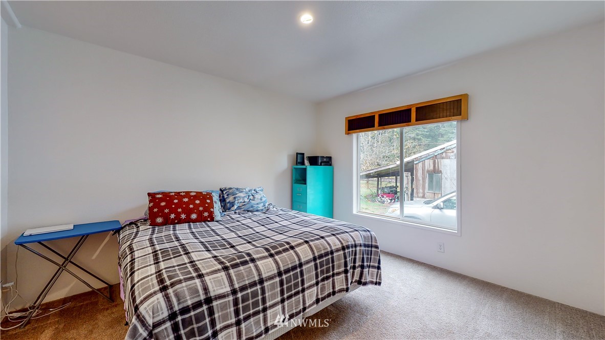 729 Cinebar Road, Unit A Cinebar, WA 98533 - Photo 17 of 30 a bedroom with a bed and a window
