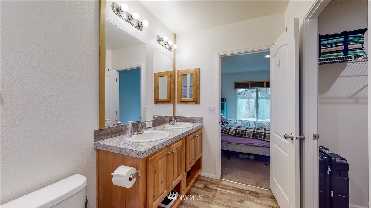 729 Cinebar Road, Unit A Cinebar, WA 98533 - Photo 20 of 30 a bathroom with a granite countertop sink and a mirror