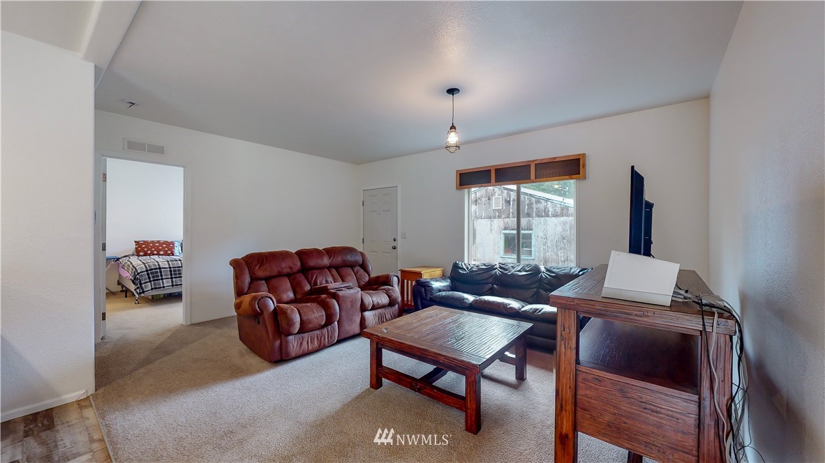729 Cinebar Road, Unit A Cinebar, WA 98533 - Photo 5 of 30 a living room with furniture and a window