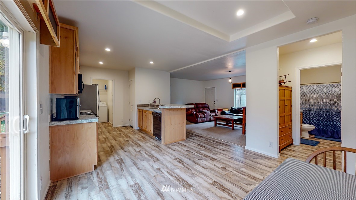 729 Cinebar Road, Unit A Cinebar, WA 98533 - Photo 7 of 30 a living room with furniture and a wooden floor