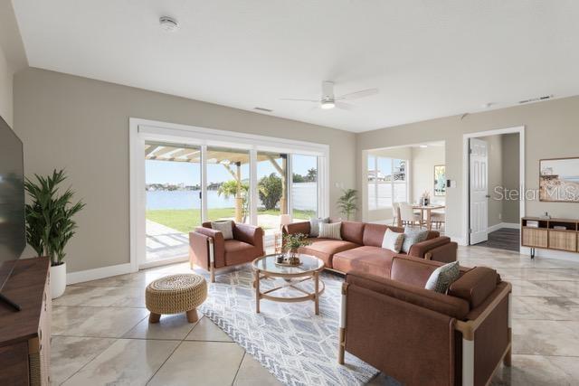 708 Sunset Cove Madeira Beach, FL 33708 - Photo 16 of 61 a living room with furniture and a large window