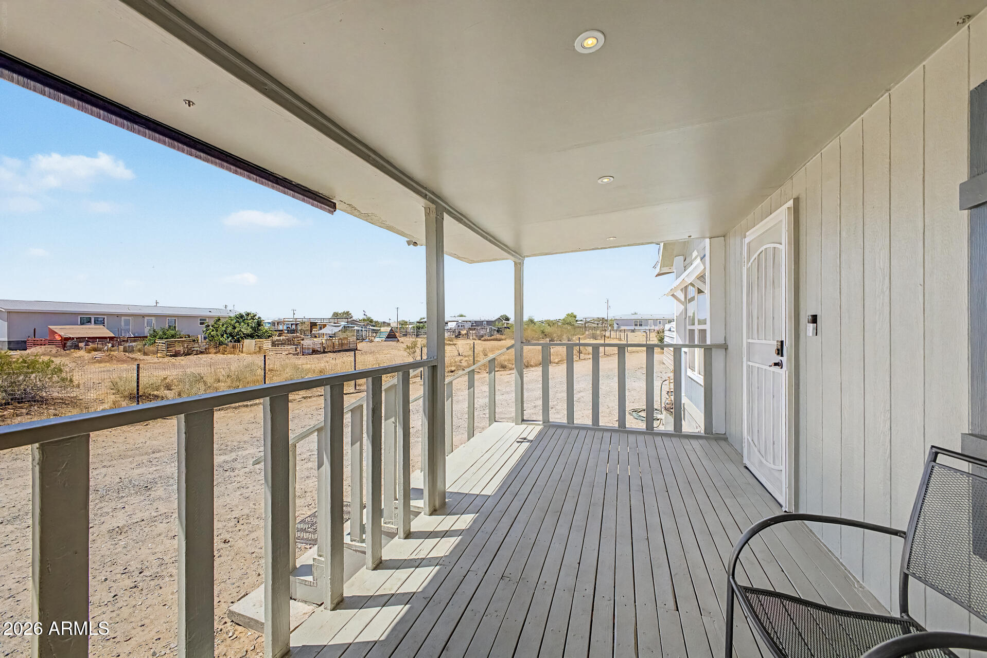 22417 West Dove Valley Road Wittmann, AZ 85361 - Photo 4 of 53 a view of a balcony with wooden floor