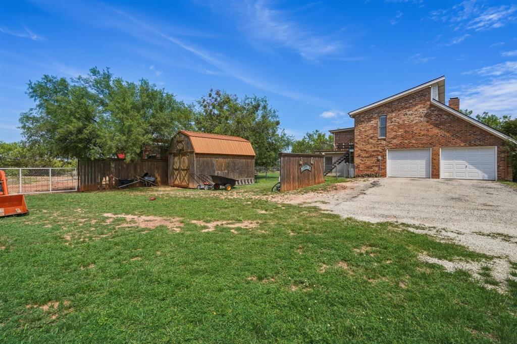 432 Clark Road Abilene, TX 79602 - Photo 37 of 40 a house view with a sitting space and garden