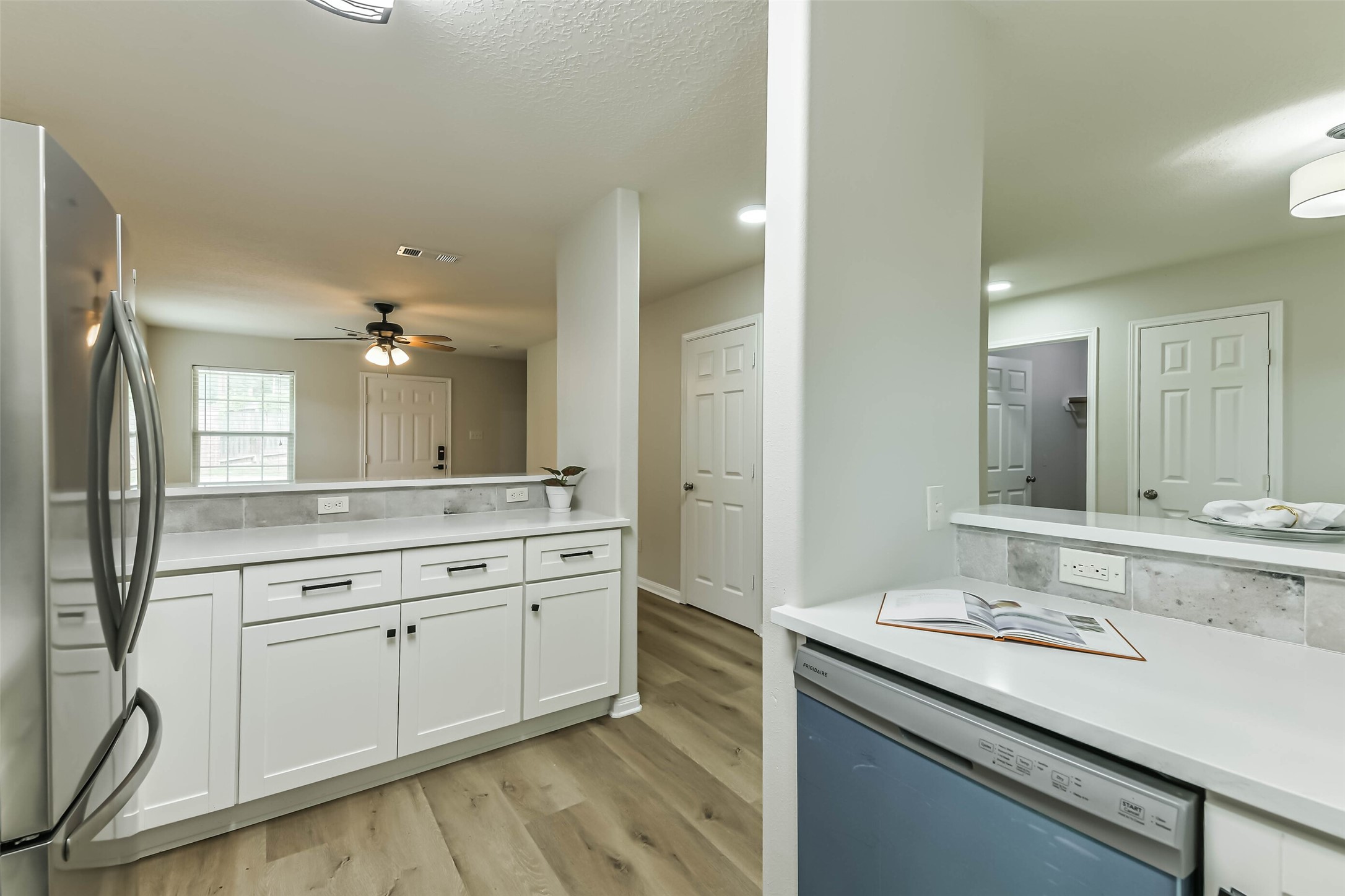 1799 League Line Road, Unit 1 Conroe, TX 77304 - Photo 9 of 32 Beautiful kitchen with sleek white cabinets and quartz counters.