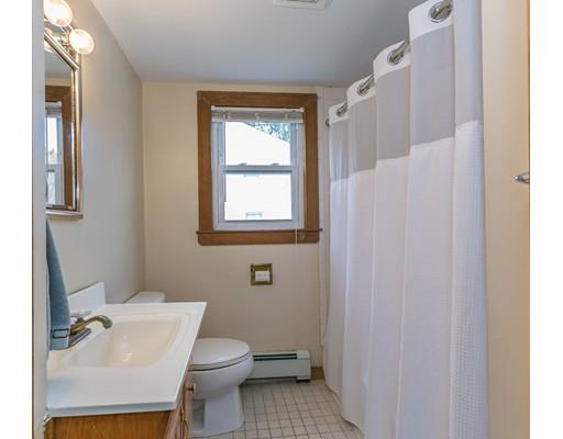 23 Rangeway Road Billerica, MA 01862 - Photo 26 of 30 a white toilet sitting next to a bathroom sink
