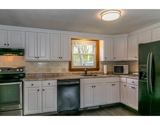 23 Rangeway Road Billerica, MA 01862 - Photo 3 of 30 a kitchen with kitchen island granite countertop a sink cabinets and stainless steel appliances