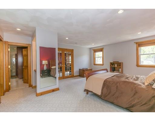 23 Rangeway Road Billerica, MA 01862 - Photo 9 of 30 a spacious bedroom with a bed a mirror and a balcony