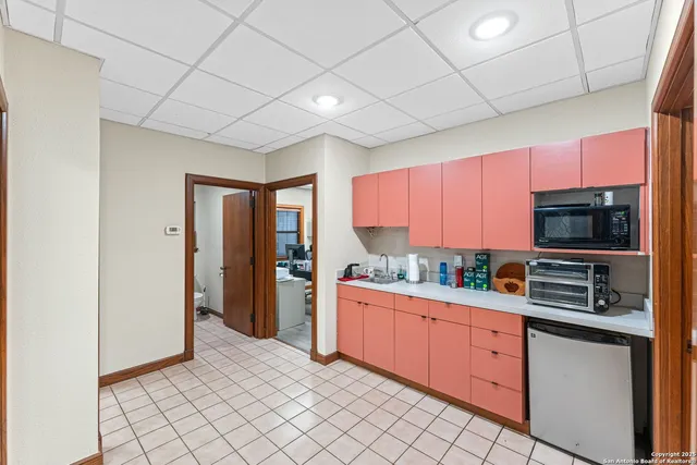 a view of a livingroom with workspace and a couch