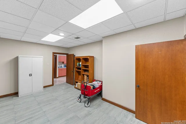 a view of a hallway with a living room