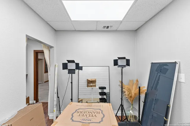 a view of a livingroom with workspace and a window