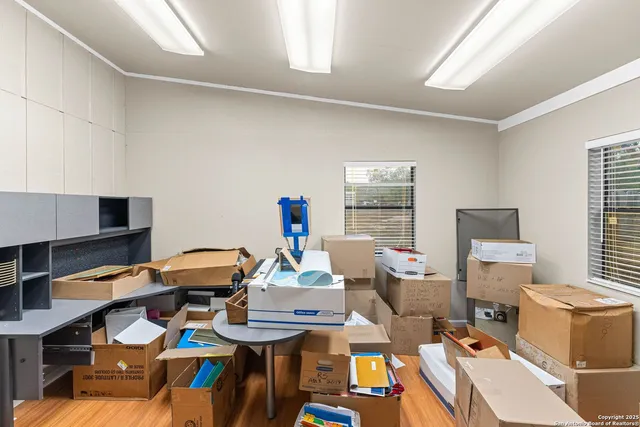 a view of an empty room with window and closet