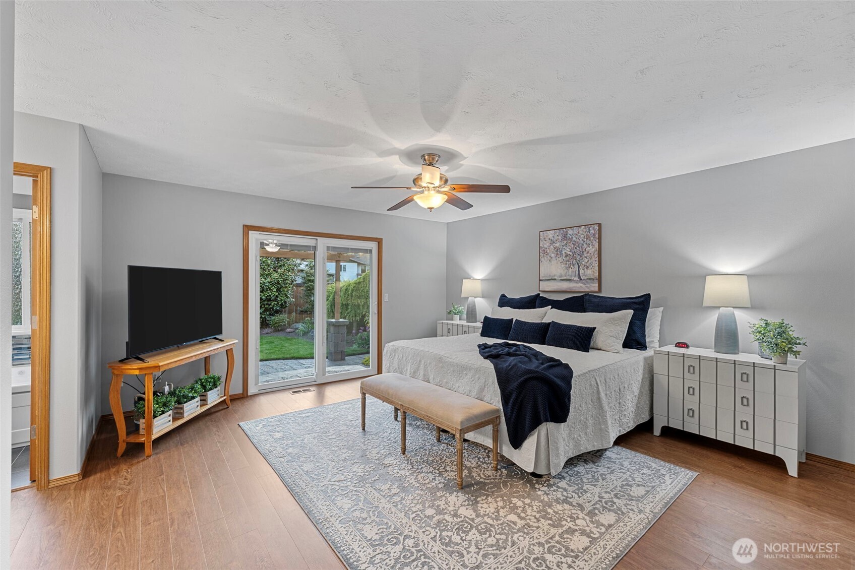 10900 39th Drive Southeast Everett, WA 98208 - Photo 14 of 39 a bedroom with bed and a flat tv screen on a dresser
