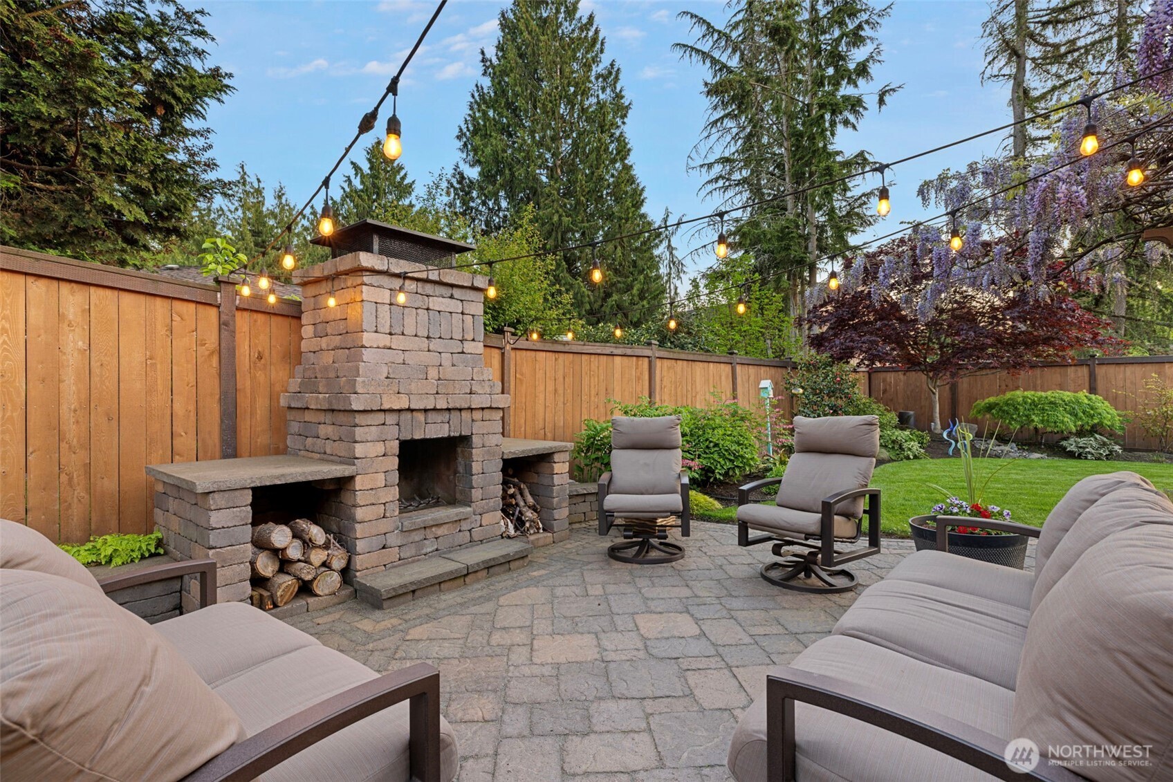 10900 39th Drive Southeast Everett, WA 98208 - Photo 29 of 39 a view of a patio with couches table and chairs with wooden fence and plants