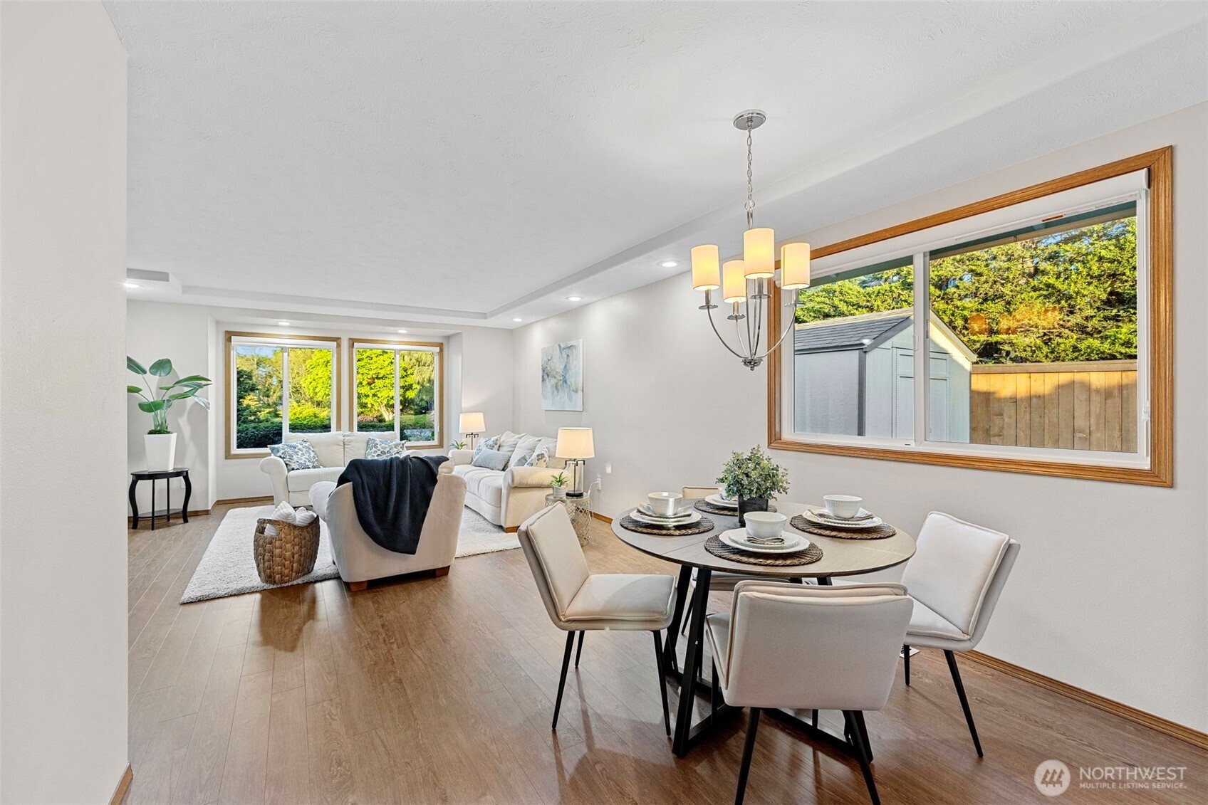 10900 39th Drive Southeast Everett, WA 98208 - Photo 8 of 39 a dining room with furniture a chandelier and wooden floor
